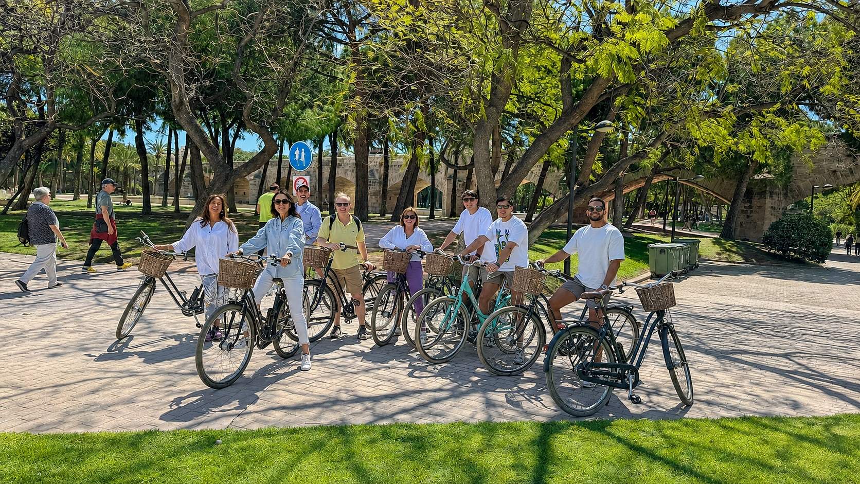 The group pauses in front of a Valencia landmark
