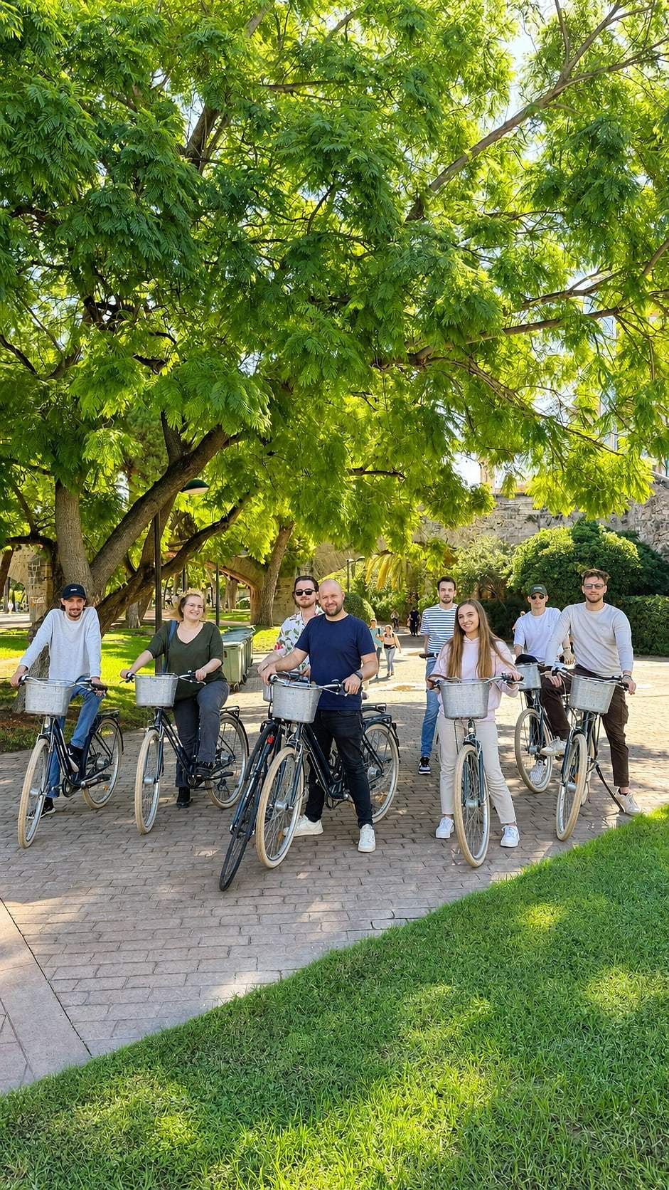 Cyclists gather on the tour route through Valencia