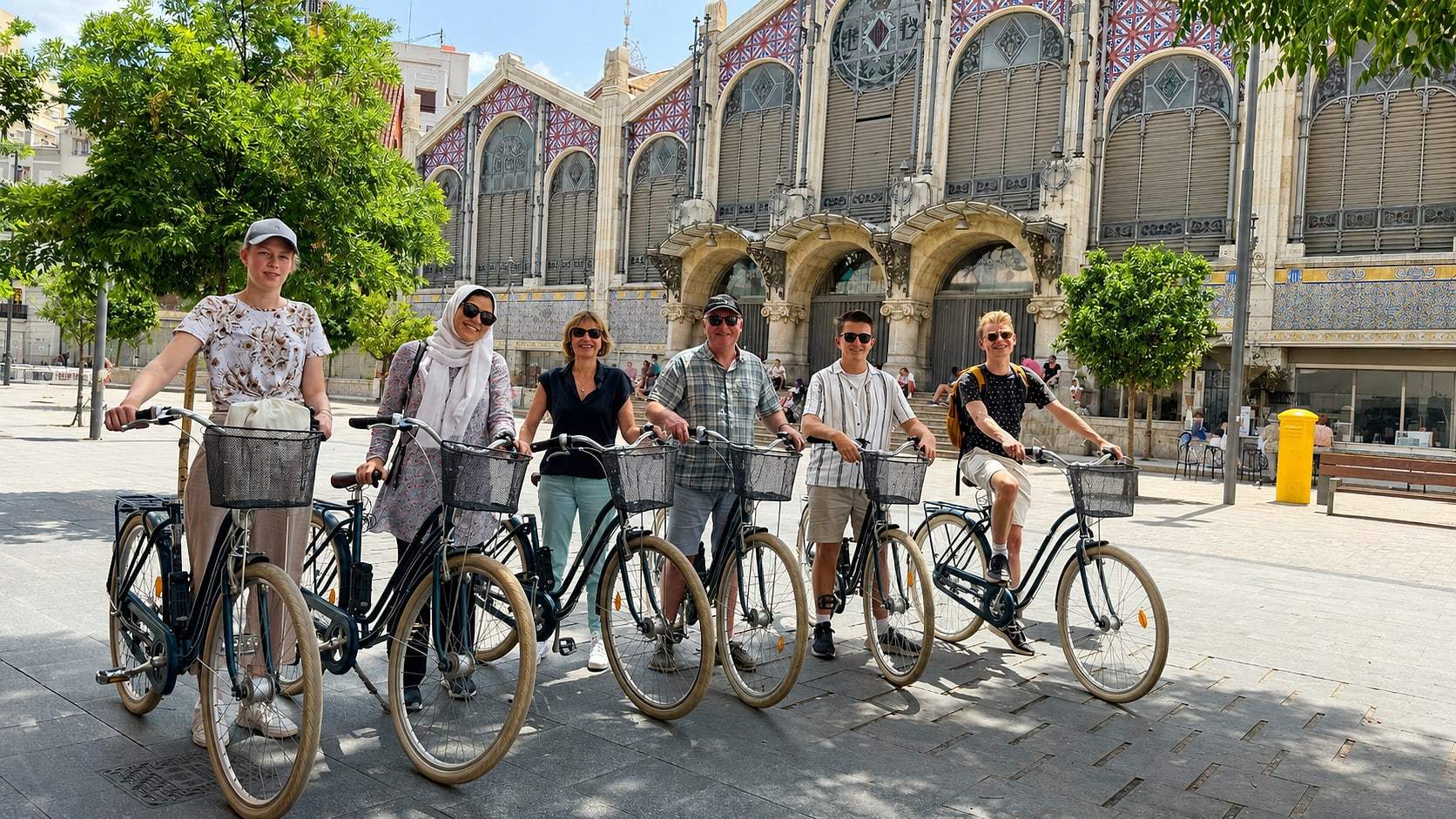 Guests stop for a photo during the daily bike tour