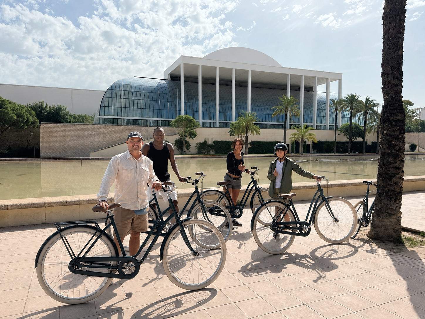 The group pauses in front of a Valencia landmark